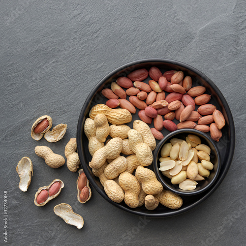 flat lay of peanuts in the shell, peanuts in skin and shelled peanuts photo