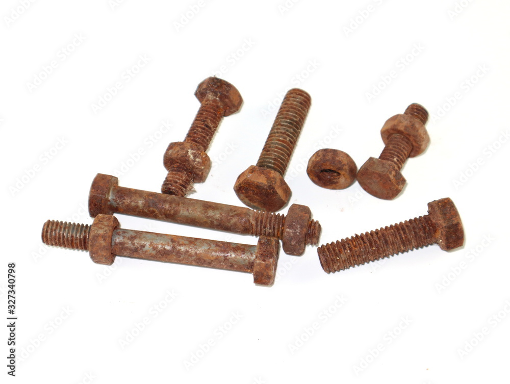 old rusty bolts and nuts isolated on white background. old rusty bolts and nuts isolated on white background.