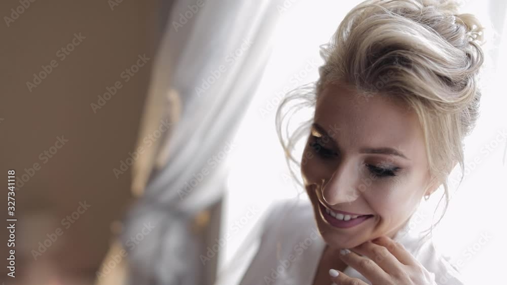 Beautiful and lovely bride in night gown and veil. Wedding morning. Slow motion Beautiful and lovely bride in night gown and veil. Wedding morning. Slow motion
