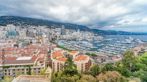 Monte Carlo city aerial panorama timelapse. View of luxury yachts and apartments in harbor of Monaco, Cote d'Azur.