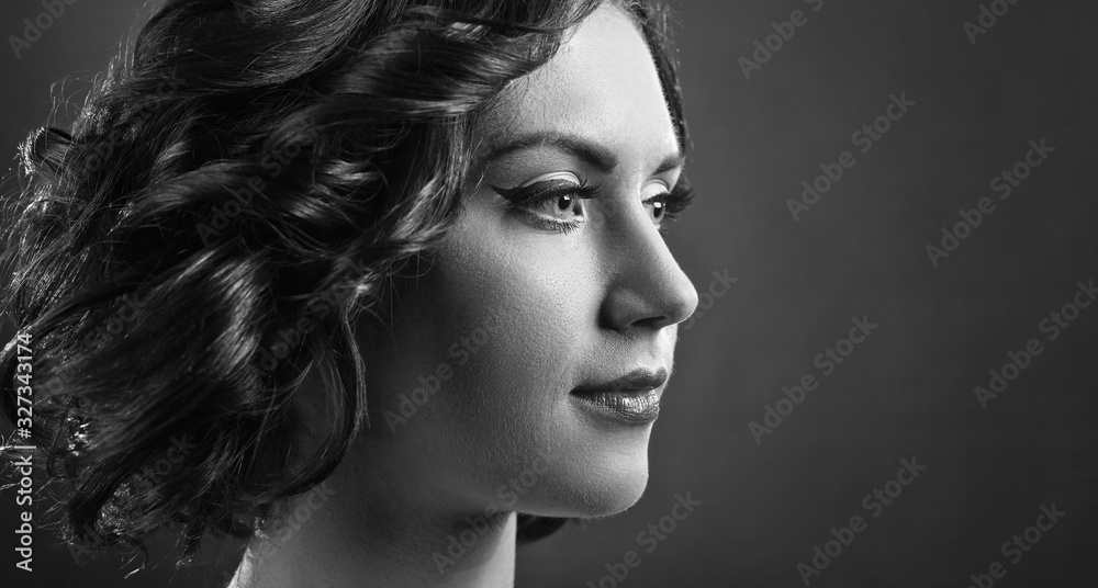 Portrait of beautiful woman with perfect curly hair and professional makeup. Portrait of beautiful woman with perfect curly hair and professional makeup.