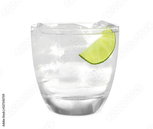 Glass of refreshing drink with ice cubes on white background
