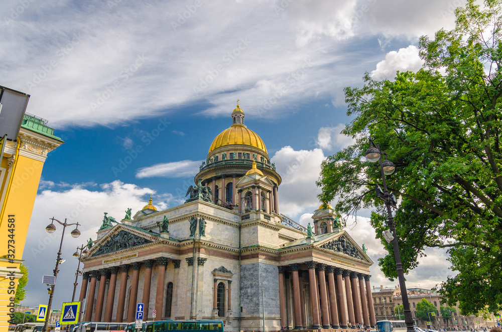 Saint Isaac's Cathedral or Isaakievskiy Sobor museum, neoclassical style building with golden dome, Russian Orthodox Church, blue sky white clouds, Saint Petersburg Leningrad city, Russia