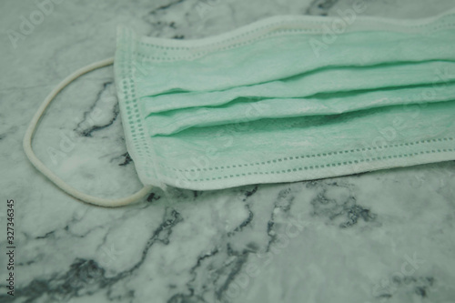 Face mask. Medical mask for protect against the spread of virus on the background. Protection  Covid-2019.  Corona virus.  photo