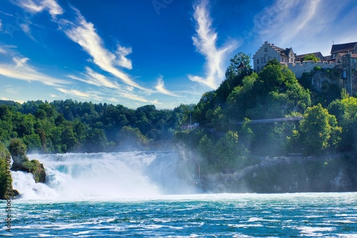Bild auf Leinwand the famous rhine falls in the swiss near the city of Schaffhausen - sunny day an