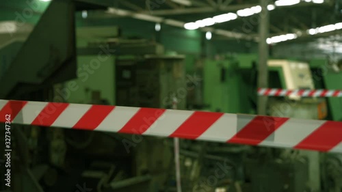 Hazardous areas and restricted areas in factory are installed with sticky white warning tape, red warning symbol and caution.