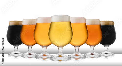 Photos A row of refreshing lager, beer, cider and stout, in schooner glasses, with cond
