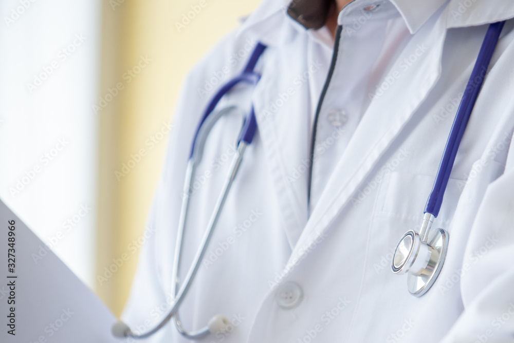 Doctor Holding Documents Standing In Clinic With Patient Doctor Holding Documents Standing In Clinic With Patient
