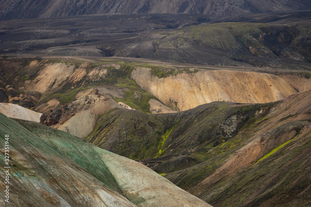 Landmannalaugar Colorful mountains on the Laugavegur hiking trail. Iceland. The combination of layers of multi-colored rocks, minerals, grass and moss