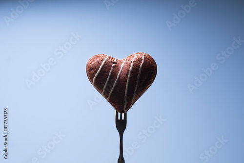 Heart shaped brownie cake on fork photo