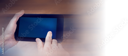 businessman holds tablet in hand