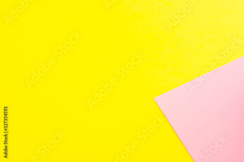 a sheet of pink paper on a yellow background