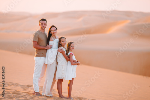 People among dunes in Rub al-Khali desert in United Arab Emirates
