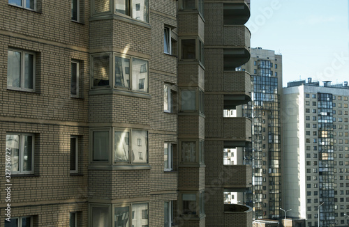  Apartment buildings. Windows and balconies. Urbanism. Sunny day.