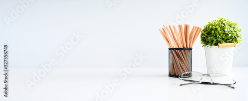 Wooden pencil and plant cactus copy space on table background