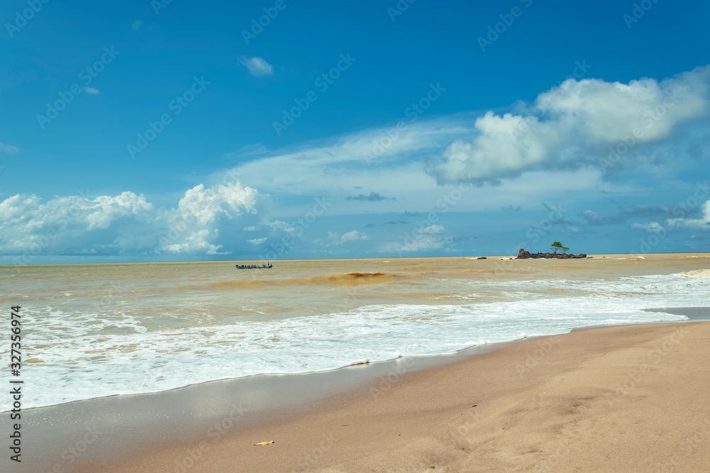 Africa gold coast where the sea is colored by the sand. Axim beach is located in Ghana West Africa. Africa gold coast where the sea is colored by the sand. Axim beach is located in Ghana West Africa.