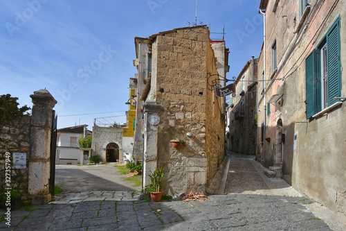 Montesarchio, Italy, 02/29/2020. A narrow street between the old houses of a medieval village. photo