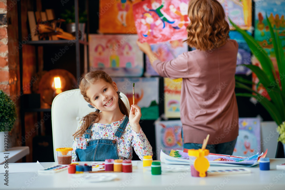 Fototapeta premium mother and child daughter painting draws in creativity in kindergarten.