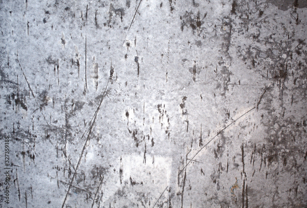 Сoncrete gray wall with dark scratches. Background.