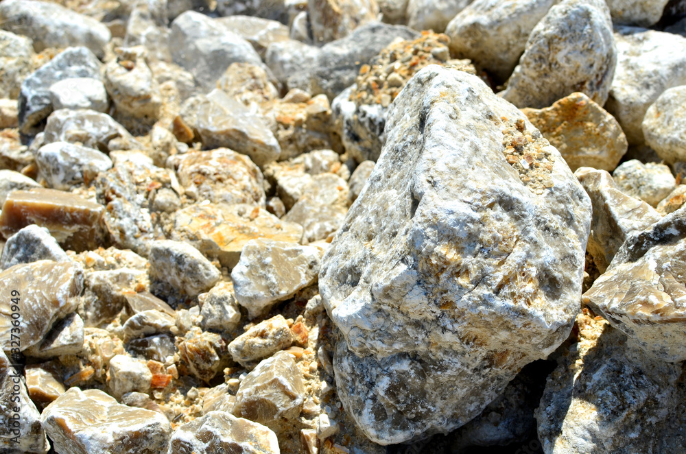 Natural gray gypsum stone. Close up image of stones with black and white. Industrial mining area. Limestone mining, quarry - Image Natural gray gypsum stone. Close up image of stones with black and white. Industrial mining area. Limestone mining, quarry - Image