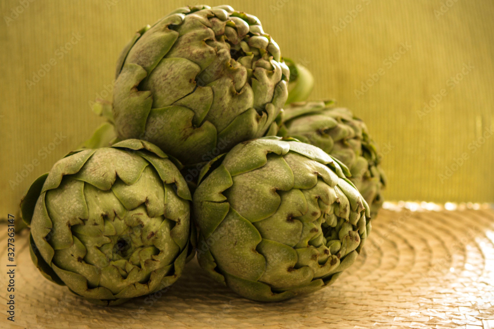 Fototapeta premium white and green artichokes on the table