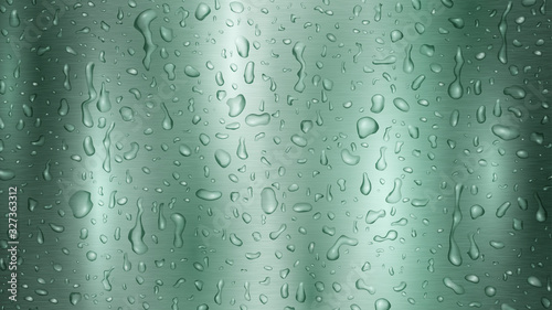 Background with drops and streaks of water in turquoise colors, flowing down the metal surface