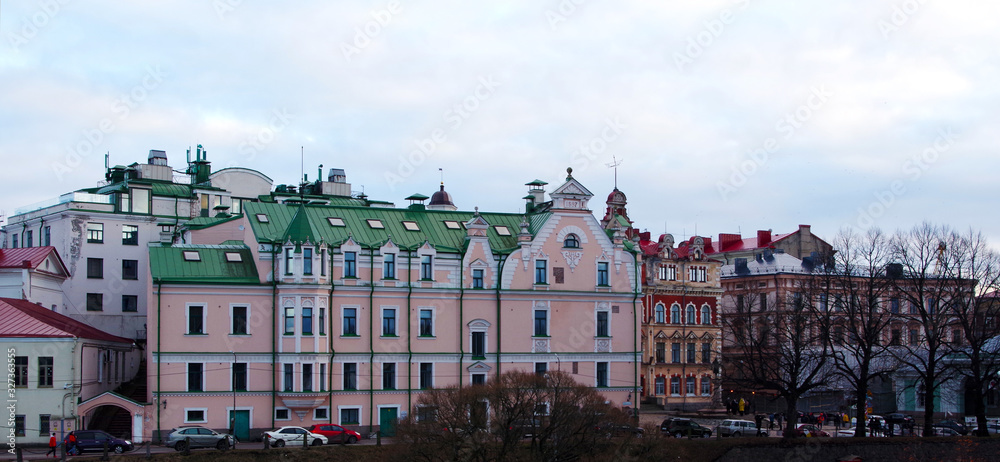 A view of Viborg - town of Russia, historic buildings along a street, winter cloudy day