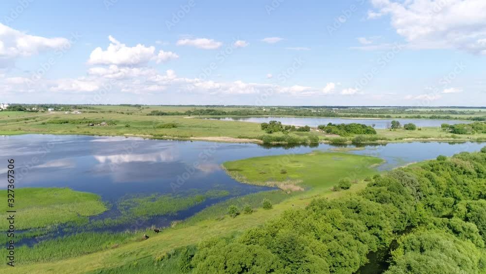 Flying on a drone over a beautiful pond in the countryside, Russia Flying on a drone over a beautiful pond in the countryside, Russia