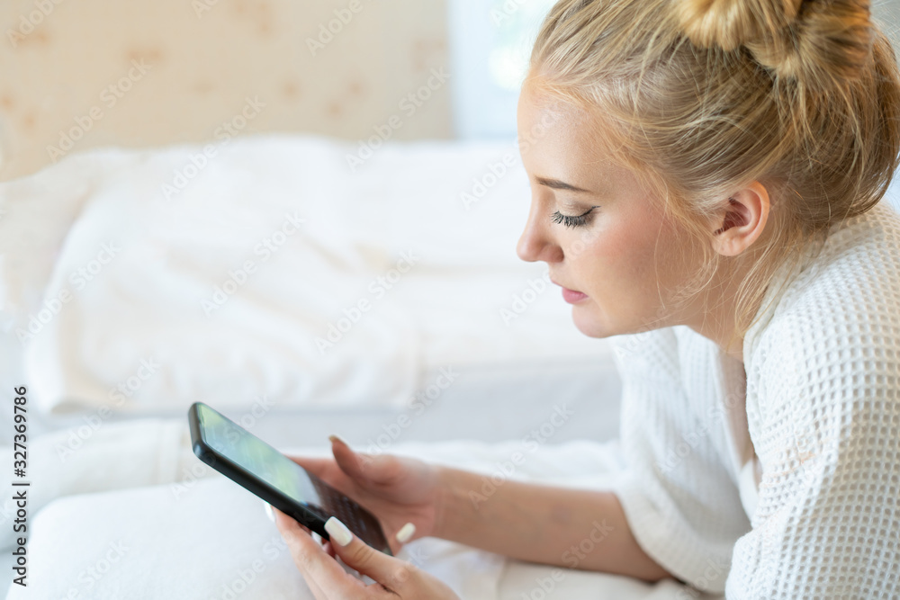 Caucasian woman in pajamas sleep alone in bed with loneliness. Typing message in smartphone for contact her husband come back home. Crying, sad because of quarrel and not understanding each other Caucasian woman in pajamas sleep alone in bed with loneliness. Typing message in smartphone for contact her husband come back home. Crying, sad because of quarrel and not understanding each other