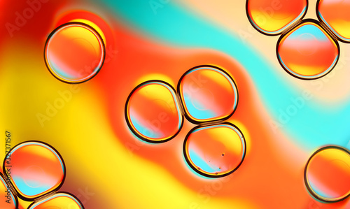 Macro PHOTO of oil and water bubbles abstract in warm reds and yellows