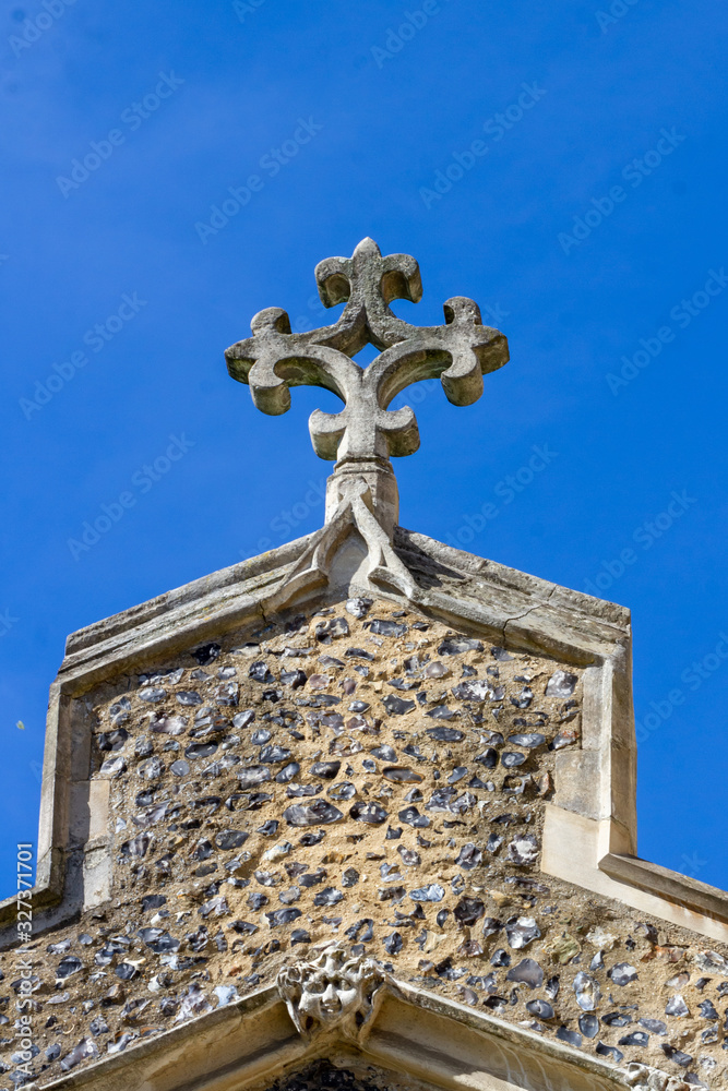 Rose cross on St Mary's Church in Ware, UK. Parts of this building date back to the 13th century