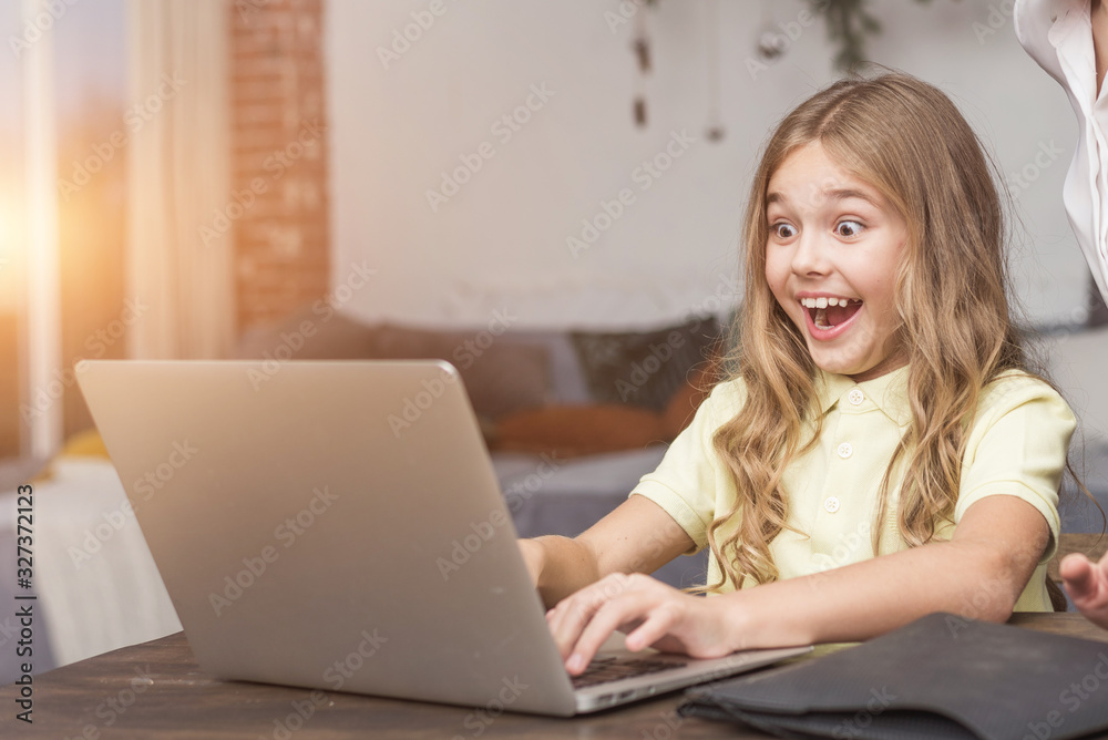 Young emotional girl very excited and working with laptop Young emotional girl very excited and working with laptop