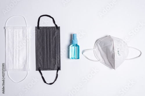 The equipment to protect COVID-19, multi color mask and hand cleaner gel with Isolated on white background concept.