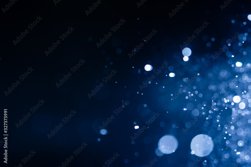 Obraz premium Streszczenie niebieski bokeh nieostre brokat rozmycie tła.