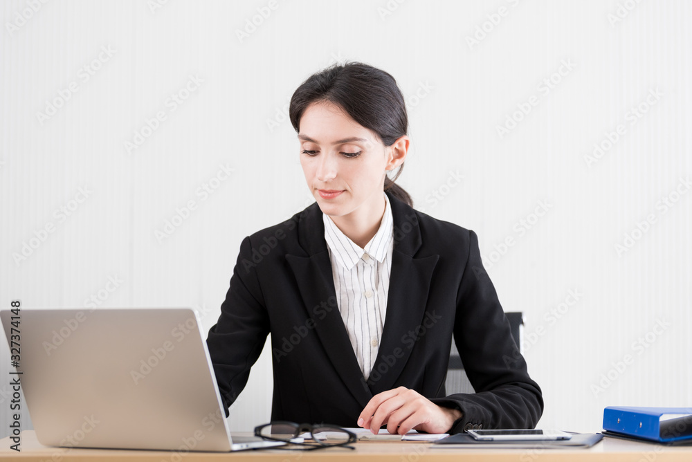 A businesswoman has working with concentrate and happiness. A businesswoman has working with concentrate and happiness.