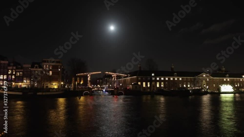 Wallpaper Mural Famous canals and embankments of Amsterdam city. General view of the cityscape and traditional Netherlands architecture. HD Time Lapse 2 in 1. Torontodigital.ca