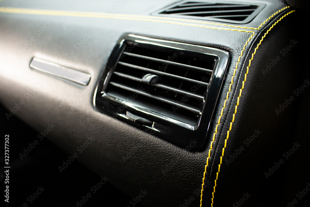 tangled leather car panel with yellow trim stitching