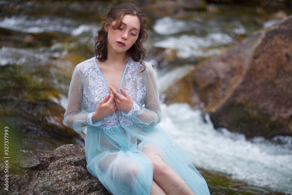 The Tale of the Mermaid. Tale of the River Nymph. Girl in a blue dress by the river. The Tale of the Mermaid. Tale of the River Nymph. Girl in a blue dress by the river.