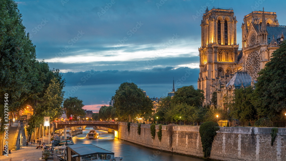 Cathedral Notre Dame de Paris day to night timelapse after sunset in Paris, France.