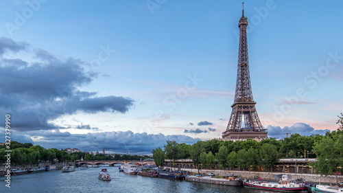The Eiffel Tower day to night Timelapse with boat station. Paris, France © neiezhmakov
