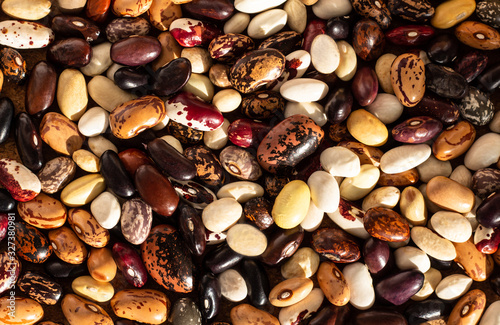 assortment of dried multi-colored beans from above, healthy ingredient, background