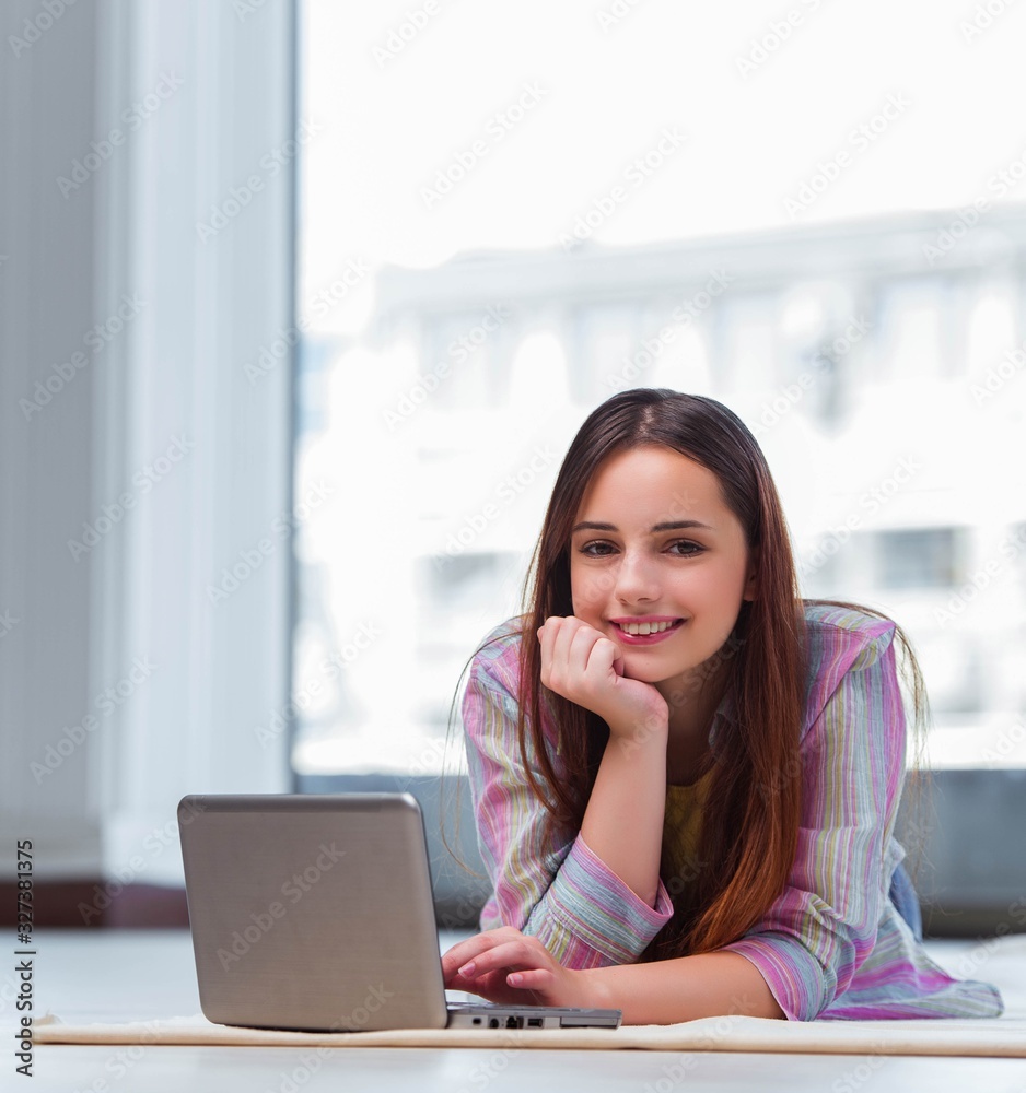 Young girl surfing internet on laptop Young girl surfing internet on laptop