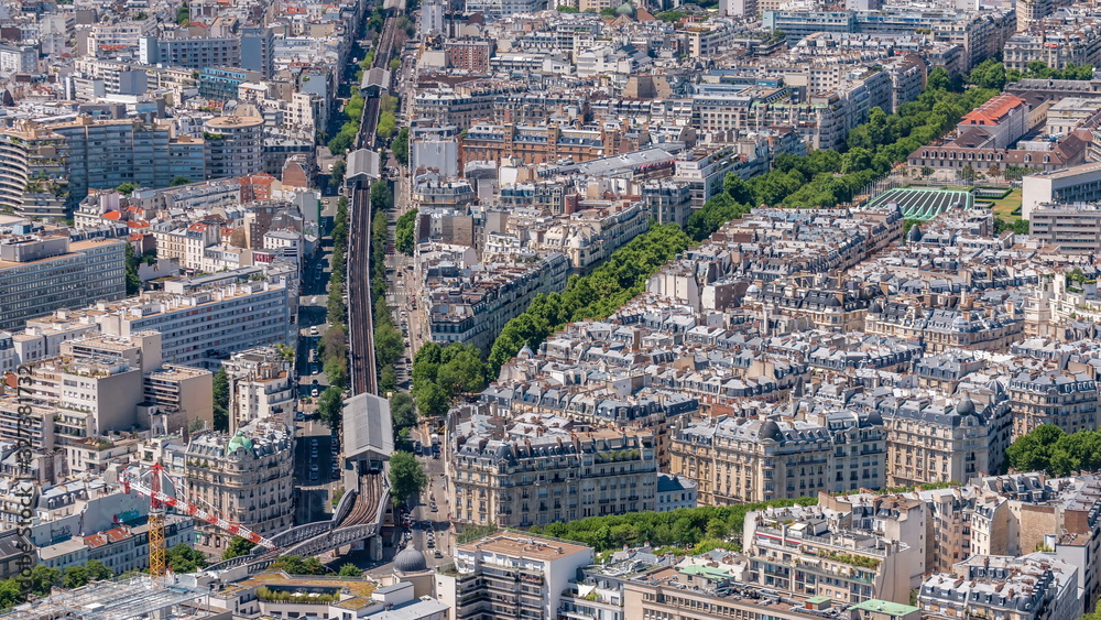 Obraz premium Top view of Paris skyline from observation deck of Montparnasse tower timelapse. Main landmarks of european megapolis. Paris, France