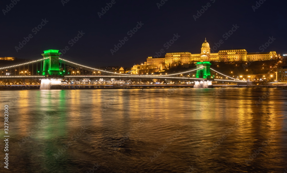 Chain Bridge with green lights on St. Patrick's day in Budapest