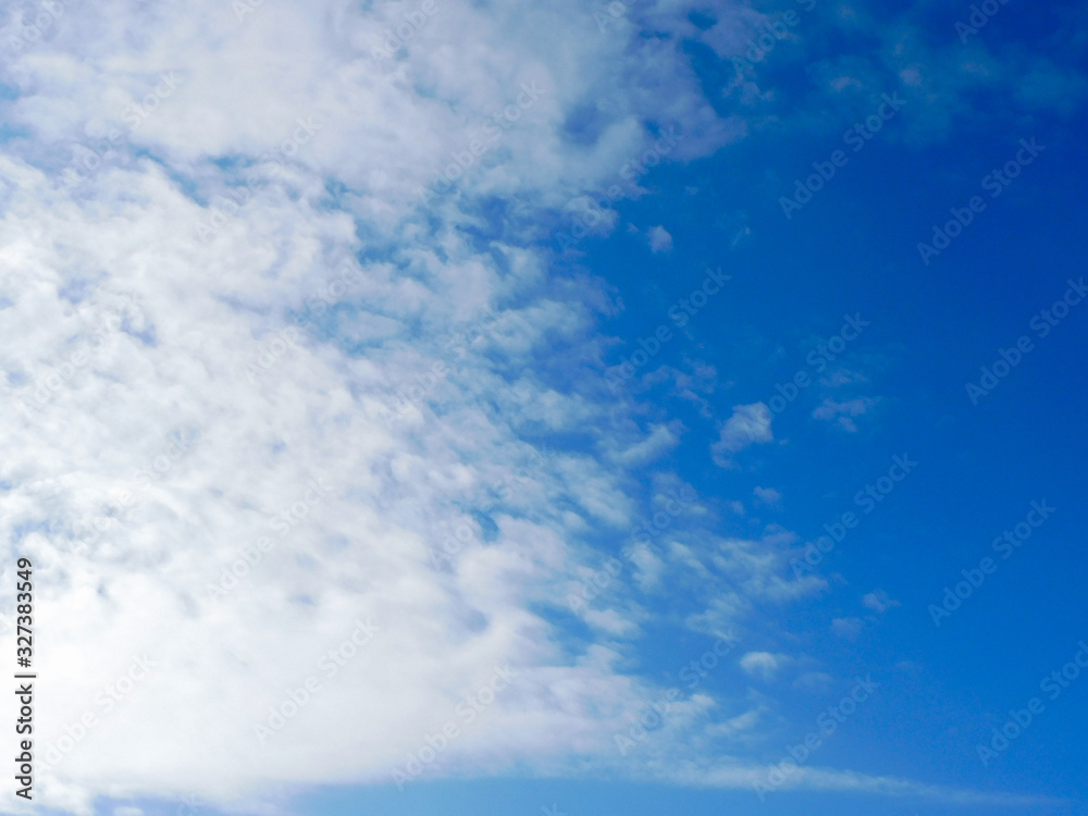 Blue spring sky with broken white clouds Blue spring sky with broken white clouds