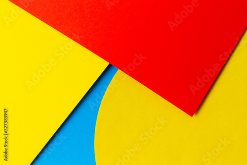Abstract colored paper texture background. Minimal geometric shapes and lines in light blue  red and yellow colours