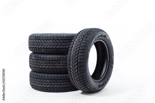 four black tires isolated on white background