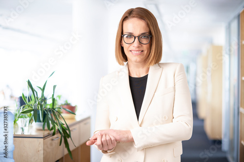 Free Download Confident businesswoman portrait in the office - GFXLoad
