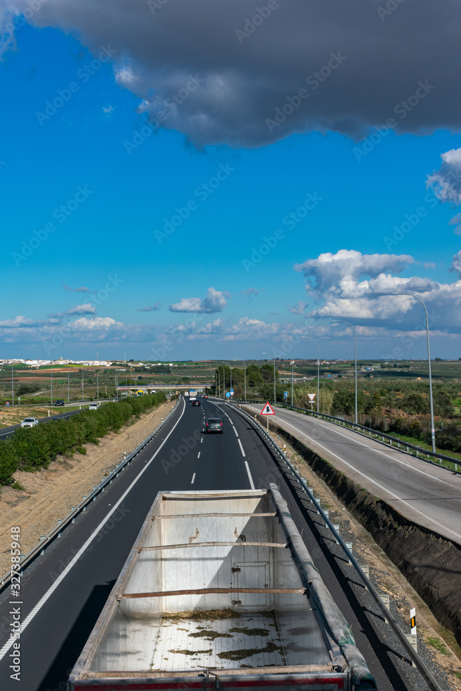 Truck with a semi-trailer for bulk transport open from above and with overhead view Truck with a semi-trailer for bulk transport open from above and with overhead view