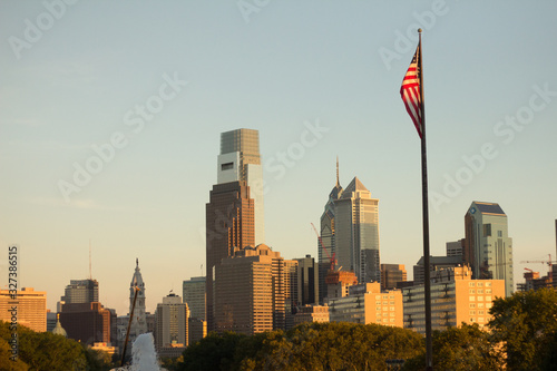 The US flag, with Philadelphia in the background